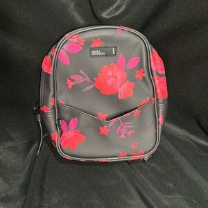 Like new mini Justice backpack